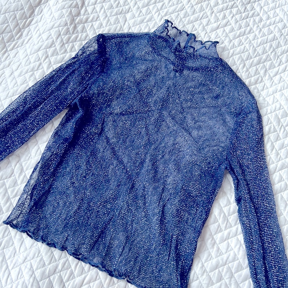 Sheer blue metallic long sleeve shirt with fancy edge collar.